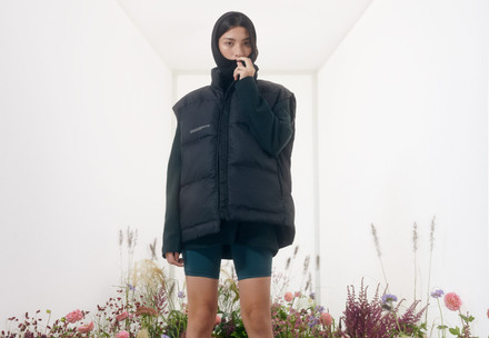 Pangaia Case Study Woman in a outerwear vest standing in a flower field