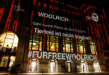 Night projection in front of the Woolrich store in Hamburg for the campaign start for the anti fur campaign