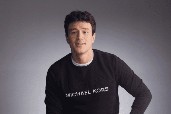 Creator Will Moncada sitting in front of gray background